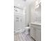 Stylish bathroom featuring a glass-enclosed shower, herringbone tile floor, and neutral color palette at 3513 Forest Oaks Dr, Chapel Hill, NC 27514