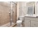 This bathroom offers a glass shower enclosure with tiled walls and modern fixtures at 3513 Forest Oaks Dr, Chapel Hill, NC 27514