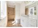 Bright bathroom features a walk-in shower with tile surround, and a modern vanity at 3513 Forest Oaks Dr, Chapel Hill, NC 27514