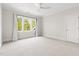 Bright and airy bedroom with neutral carpet, large window, and ample natural light at 3513 Forest Oaks Dr, Chapel Hill, NC 27514