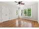 Bright bedroom features hardwood floors, neutral paint, and lots of natural light at 3513 Forest Oaks Dr, Chapel Hill, NC 27514