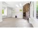 Bright bonus room with carpet, a stone fireplace, skylights, and multiple windows at 3513 Forest Oaks Dr, Chapel Hill, NC 27514