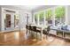 Dining room with French doors leading to the outdoor patio area and lots of natural light at 3513 Forest Oaks Dr, Chapel Hill, NC 27514