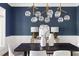 Dining room featuring modern lighting and stylish table decor at 3513 Forest Oaks Dr, Chapel Hill, NC 27514