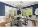 Bright dining room showcasing stylish chandelier, a view of the staircase, and natural light at 3513 Forest Oaks Dr, Chapel Hill, NC 27514