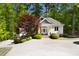 Exterior view of a detached building with manicured landscaping and a long driveway at 3513 Forest Oaks Dr, Chapel Hill, NC 27514