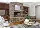 Living room featuring a stone fireplace and hardwood floors at 3513 Forest Oaks Dr, Chapel Hill, NC 27514