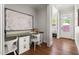 Bright home office with built-in desk and hardwood floors at 3513 Forest Oaks Dr, Chapel Hill, NC 27514