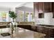 Kitchen featuring granite countertops, a stylish backsplash, stainless steel appliances, and a backyard view at 3513 Forest Oaks Dr, Chapel Hill, NC 27514