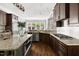 Spacious kitchen featuring granite countertops, stainless steel appliances, and a large island at 3513 Forest Oaks Dr, Chapel Hill, NC 27514