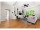 Bright living room boasts hardwood floors, an open floorplan, and built-in shelving at 3513 Forest Oaks Dr, Chapel Hill, NC 27514