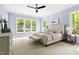 Main bedroom with large windows offering scenic views at 3513 Forest Oaks Dr, Chapel Hill, NC 27514