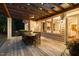 Charming outdoor dining area with wooden deck and long table, perfect for gatherings with cozy ambiance at 3513 Forest Oaks Dr, Chapel Hill, NC 27514