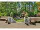 Multi-tiered deck leading to a beautifully landscaped backyard and patio at 3826 Regent Rd, Durham, NC 27707