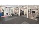 Basement transformed into a home gym featuring exercise equipment and rubber flooring at 3826 Regent Rd, Durham, NC 27707