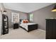 Comfortable bedroom with neutral tones, featuring a full sized bed and ample natural light at 3826 Regent Rd, Durham, NC 27707