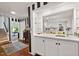Modern white kitchen featuring a bright countertop, ample cabinets, and stainless steel appliances at 3826 Regent Rd, Durham, NC 27707