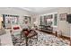 Bright living room with a large bay window offering ample natural light and stylish furniture at 3826 Regent Rd, Durham, NC 27707
