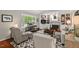 Comfortable living room with built-in bookshelves, fireplace, and hardwood floors at 3826 Regent Rd, Durham, NC 27707