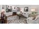 Elegant living room with built-in shelving, fireplace, neutral tones, and stylish furniture at 3826 Regent Rd, Durham, NC 27707