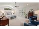 Spacious main bedroom with a ceiling fan, large windows, and neutral tones at 3826 Regent Rd, Durham, NC 27707