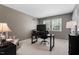 Spacious office area features a large desk and a relaxing chair by the window at 3826 Regent Rd, Durham, NC 27707