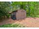 Outdoor storage shed sitting on a grassy lot at 3826 Regent Rd, Durham, NC 27707