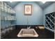 Close up of wet bar with sink, wine rack, and barware storage at 3826 Regent Rd, Durham, NC 27707