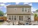Two-story home with a large backyard featuring a patio with outdoor furniture at 406 Sapphire Dr, Durham, NC 27703
