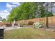 Spacious backyard with patio, perfect for outdoor entertaining and relaxation amongst lush greenery at 406 Sapphire Dr, Durham, NC 27703
