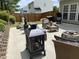 Backyard patio with cozy seating and fireplace, perfect for outdoor entertainment at 406 Sapphire Dr, Durham, NC 27703