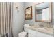 Small bathroom featuring a vanity with granite countertops, ornate gold lighting and vintage wall art at 406 Sapphire Dr, Durham, NC 27703