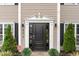 Elegant front door with decorative trim and landscaping at 406 Sapphire Dr, Durham, NC 27703