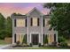 Charming two-story home with meticulously landscaped front yard and black accents at 406 Sapphire Dr, Durham, NC 27703