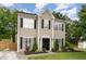 Charming two-story home with meticulously landscaped front yard and black accents at 406 Sapphire Dr, Durham, NC 27703