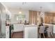 Modern kitchen with white cabinets, stainless steel appliances, granite countertops, and hardwood floors at 406 Sapphire Dr, Durham, NC 27703