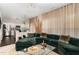 Open-concept living room with plush seating and hardwood floors at 406 Sapphire Dr, Durham, NC 27703