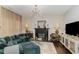 Cozy living room with fireplace, plush seating, and modern lighting at 406 Sapphire Dr, Durham, NC 27703