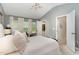 Main bedroom with vaulted ceiling and ensuite bathroom entrance, offering a private retreat at 406 Sapphire Dr, Durham, NC 27703