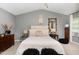 Comfortable main bedroom with a high ceiling, and tastefully decorated with unique bedside decor at 406 Sapphire Dr, Durham, NC 27703