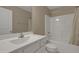 Bright bathroom with a single sink vanity and a shower-tub combo with a curtain at 42 Voyage Cir, Smithfield, NC 27577