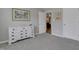 Bedroom featuring a white dresser, carpet, and a view to the hallway at 42 Voyage Cir, Smithfield, NC 27577