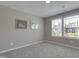 Neutral bedroom featuring gray carpet and two windows allowing natural light at 42 Voyage Cir, Smithfield, NC 27577