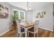 Cozy dining room with a vintage-style table, natural light, and elegant decor at 42 Voyage Cir, Smithfield, NC 27577