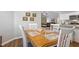 Cozy dining room with a vintage-style table adjacent to the kitchen and living room at 42 Voyage Cir, Smithfield, NC 27577