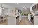 Bright kitchen featuring granite countertops, stainless steel appliances, and an open view to the living room at 42 Voyage Cir, Smithfield, NC 27577