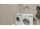 Laundry room featuring white washer and dryer, with a shelf for storage at 42 Voyage Cir, Smithfield, NC 27577