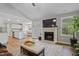 Cozy living room features fireplace and open layout to kitchen at 42 Voyage Cir, Smithfield, NC 27577