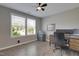 Office with modern desk setup, great natural light and ceiling fan at 42 Voyage Cir, Smithfield, NC 27577