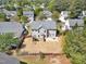 Aerial view of home showing backyard, patio, fence, and playset at 421 Gooseberry Dr, Holly Springs, NC 27540